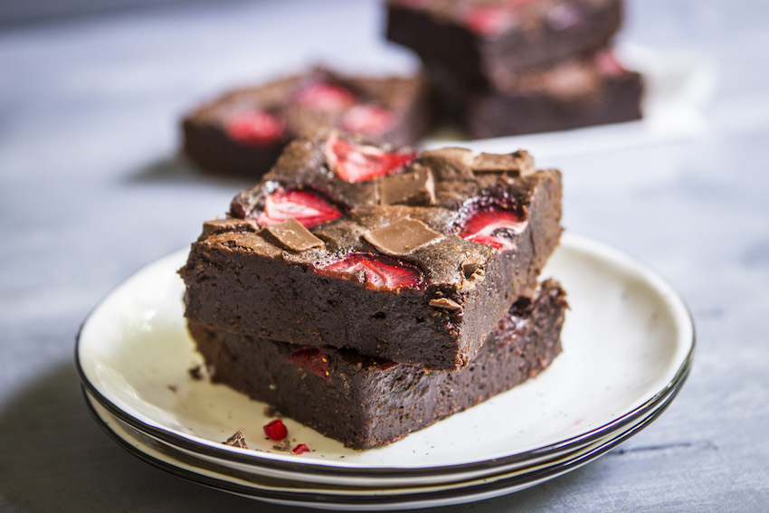 Thick, fudgy chocolate brownies topped with strawberries for an ultra-decadent summer treat. 