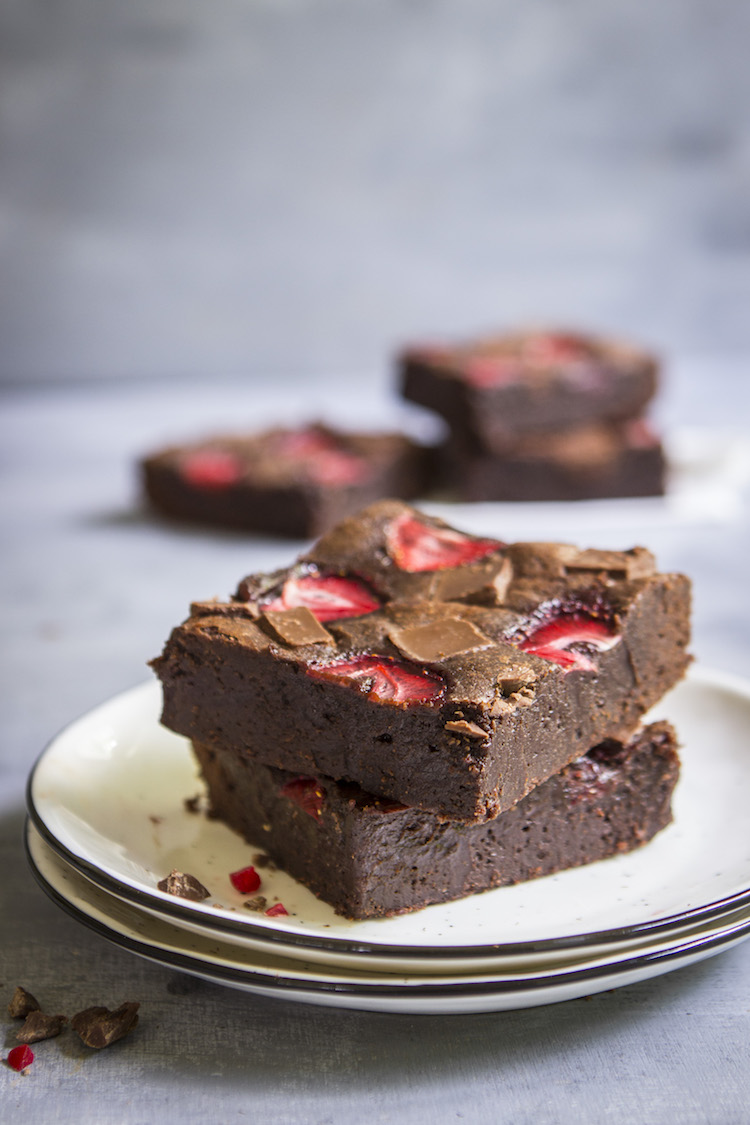 Thick, fudgy chocolate brownies topped with strawberries for an ultra-decadent summer treat. 