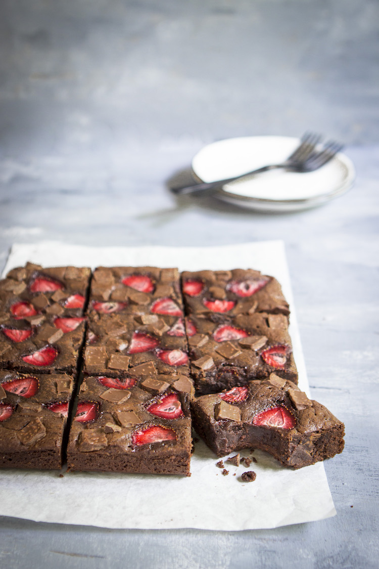 Thick, fudgy chocolate brownies topped with strawberries for an ultra-decadent summer treat.